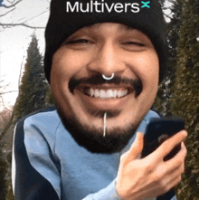 a man with a beard wearing a beanie that says multivers