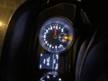 a close up of a car 's dashboard at night with a display that says b 45