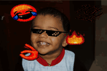 a little boy wearing sunglasses with a laughing face and a fire