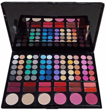 a large makeup palette with a mirror and brushes .