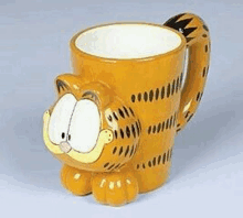 a yellow mug with garfield on it