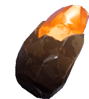 a large rock with a glowing orange crystal inside