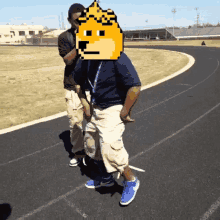 a man with a doge face on his head is walking down a track