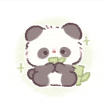 a cute panda bear is eating a green leaf .