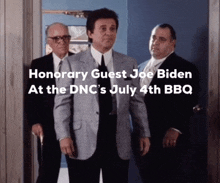 three men standing in front of a door with the words honorary guest joe biden at the dnc