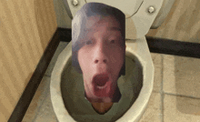 a toilet with a picture of a person 's face in it