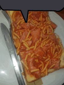 a sandwich with macaroni and cheese and tomato sauce on it