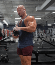 a man taking a picture of himself in a gym while wearing shorts that say smith