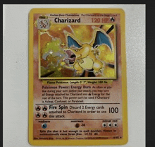 a pokemon card with charizard on it .