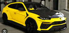 a yellow car with a black hood is parked in front of a garage