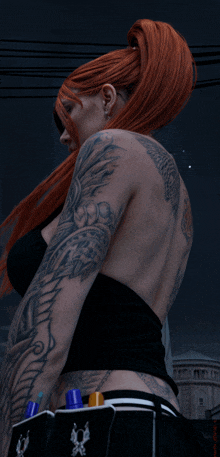 a woman with a lot of tattoos on her back