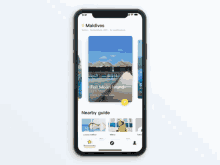 a phone screen shows a picture of maldives