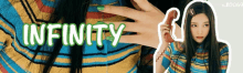 a woman with green nail polish is holding a phone and the word infinity is on the bottom