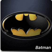 a black and yellow batman logo with the word batman below it