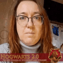 a woman wearing glasses stands in front of a hogwarts 2.0 advertisement