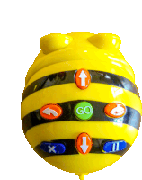 a yellow toy with a green go button in the center