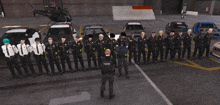 a police officer stands in front of a group of police officers