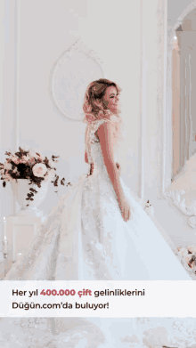 a woman in a white wedding dress is standing in front of a mirror