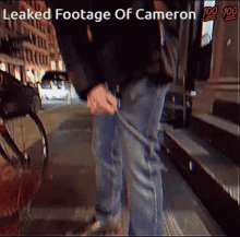 a screenshot of leaked footage of cameron shows a person walking down a street