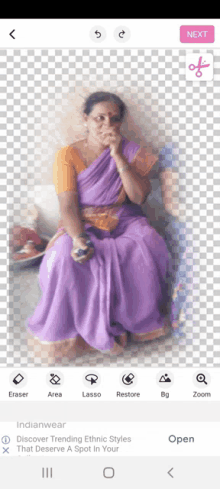 a woman in a purple dress is sitting on a white background