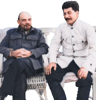 a man with a beard sits next to another man with a mustache on a bench