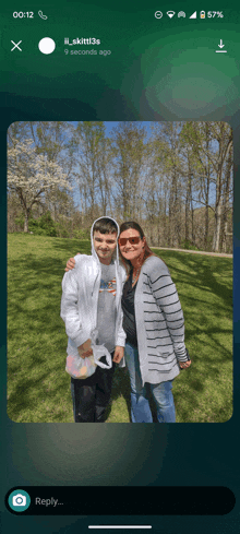 a phone screen shows a picture of a mother and son