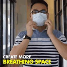 a man wearing a face mask with the words " create more breathing space " above him