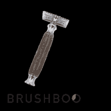 a shaving razor with a wooden handle and the words brushboo on the bottom