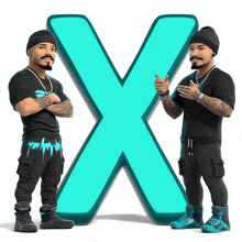 two men are standing in front of a large x