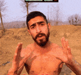 a shirtless man with a beard is standing in a dirt field with trees in the background and the words summer camp above him