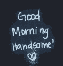 a chalkboard that says good morning handsome with a heart