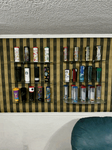 a collection of starbucks coffee cups on a shelf