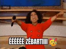 a woman is holding a microphone and screaming with the words eeeee zebartiiii on the bottom