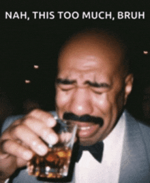 a man with a mustache is drinking from a glass and crying with the caption nah this too much bruh