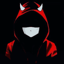 a person wearing a red hoodie with horns on it and a mask on their face .