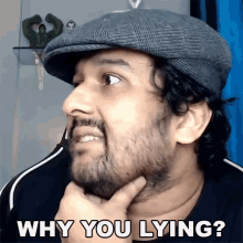 a man with a beard wearing a hat is asking why you are lying