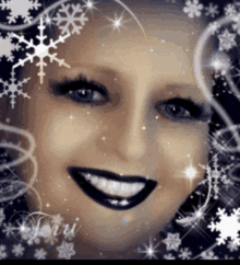 a close up of a woman 's face surrounded by snowflakes with the name torri on the bottom