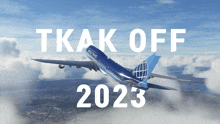 a plane is flying in the sky with the words tkak off 2023