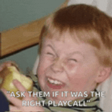 a young boy is making a funny face while holding a pear and says " ask them if it was the right play call "