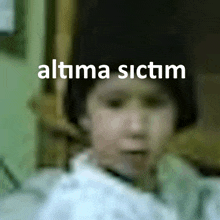 a blurry picture of a child with the words " altma sictim " on top