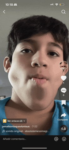 a young boy is making a funny face on a tik tok video