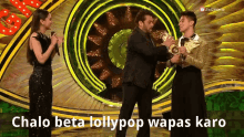 a man holding a trophy with the words chalo beta lollypop wapas karo written on the bottom