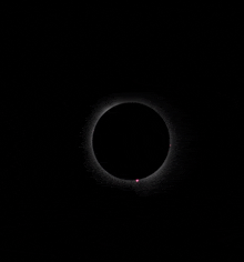 a partial eclipse of the sun with the moon visible