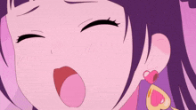 a close up of a girl with a heart shaped earring on her left ear