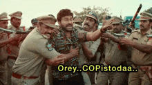 a group of police officers are standing around a man with the words orey copistodaa written on the bottom