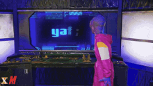 a person standing in front of a screen that says yay