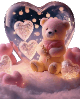 a teddy bear sits in front of a heart shaped glass ball