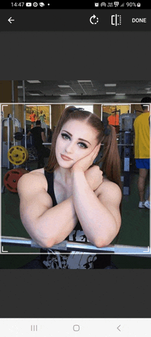 a picture of a woman in a gym with the time 14:57