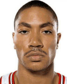 a close up of a man 's face with a beard and mustache