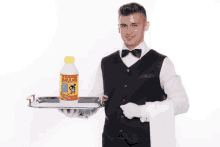 a waiter is holding a tray with a bottle on it that says ' cleaner ' on it